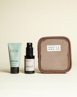 Skincare products and pouch with 'Subtle Bodies' branding on a beige background